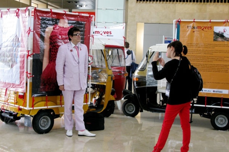 Visitors photographing the ArtMoves installation during the XVII International AIDS Conference