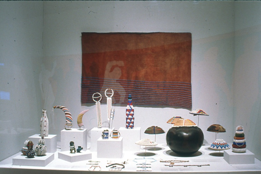 Zulu beadwork, painted panels, and telephone-wire baskets displayed in the exhibition