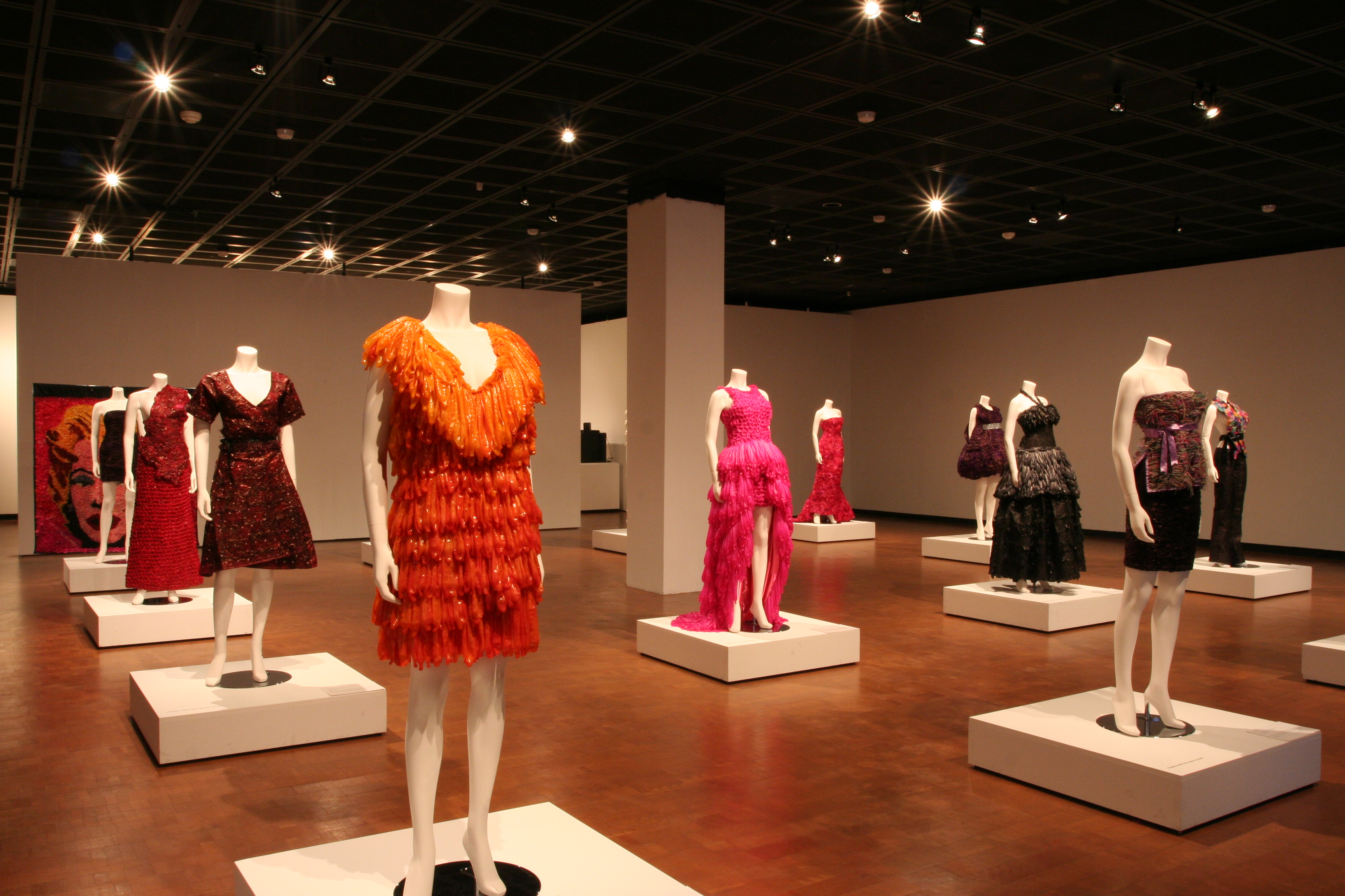 Adriana Bertini’s Condom Couture garments under dramatic lighting