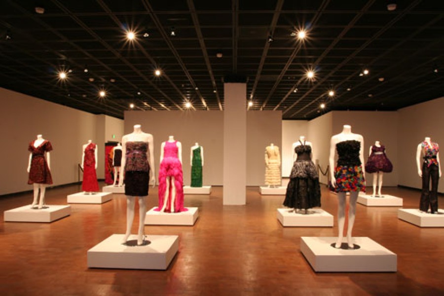 Adriana Bertini’s Condom Couture garments under dramatic lighting