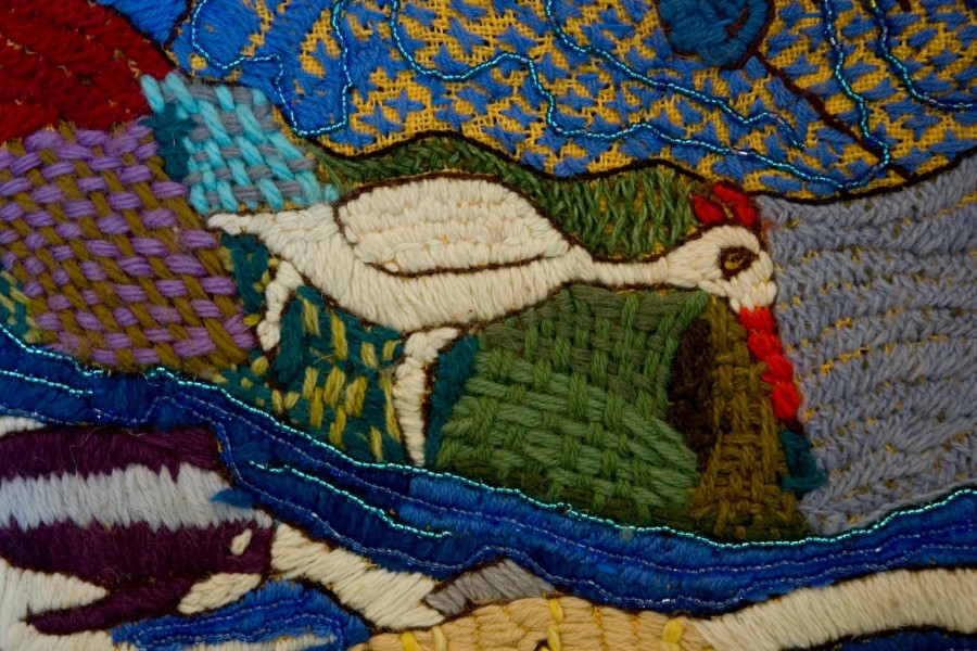 Embroidered wildlife and landscape in the second layer of the Keiskamma Altarpiece