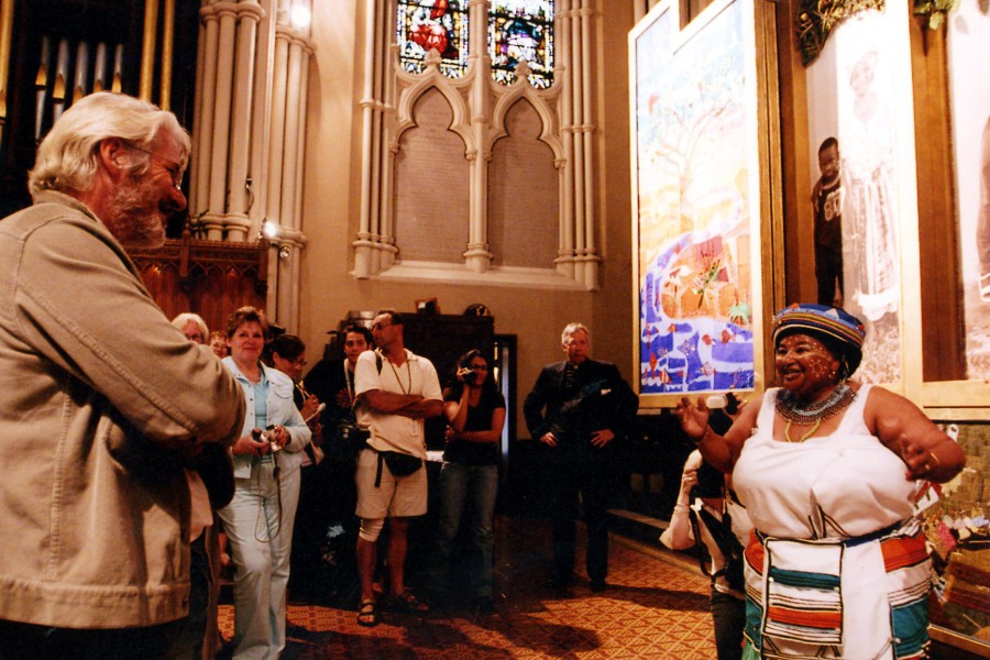 Eunice Mangwane speaking with Richard Gere at the Cathedral Church of St. James in Toronto