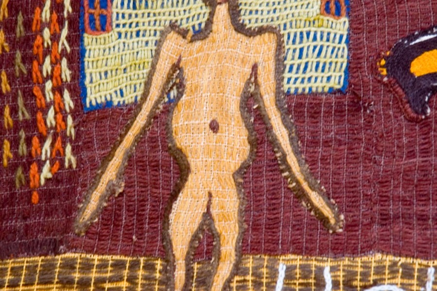 Embroidered emaciated figure in the first layer of the Keiskamma Altarpiece
