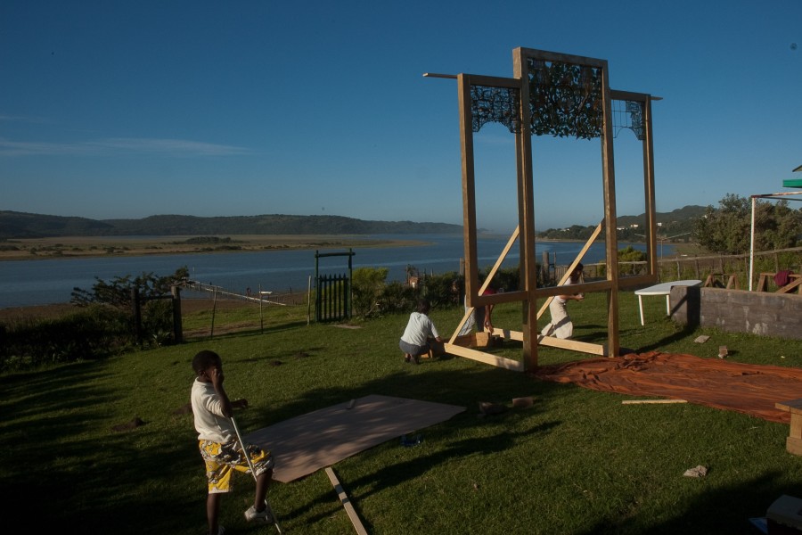 Artists assembling the Keiskamma Altarpiece outdoors in Hamburg