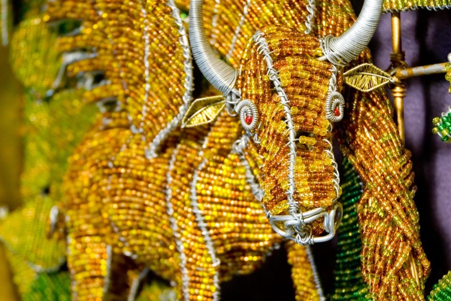 Wire beadwork depicting local animals and a flower in the third layer of the Keiskamma Altarpiece