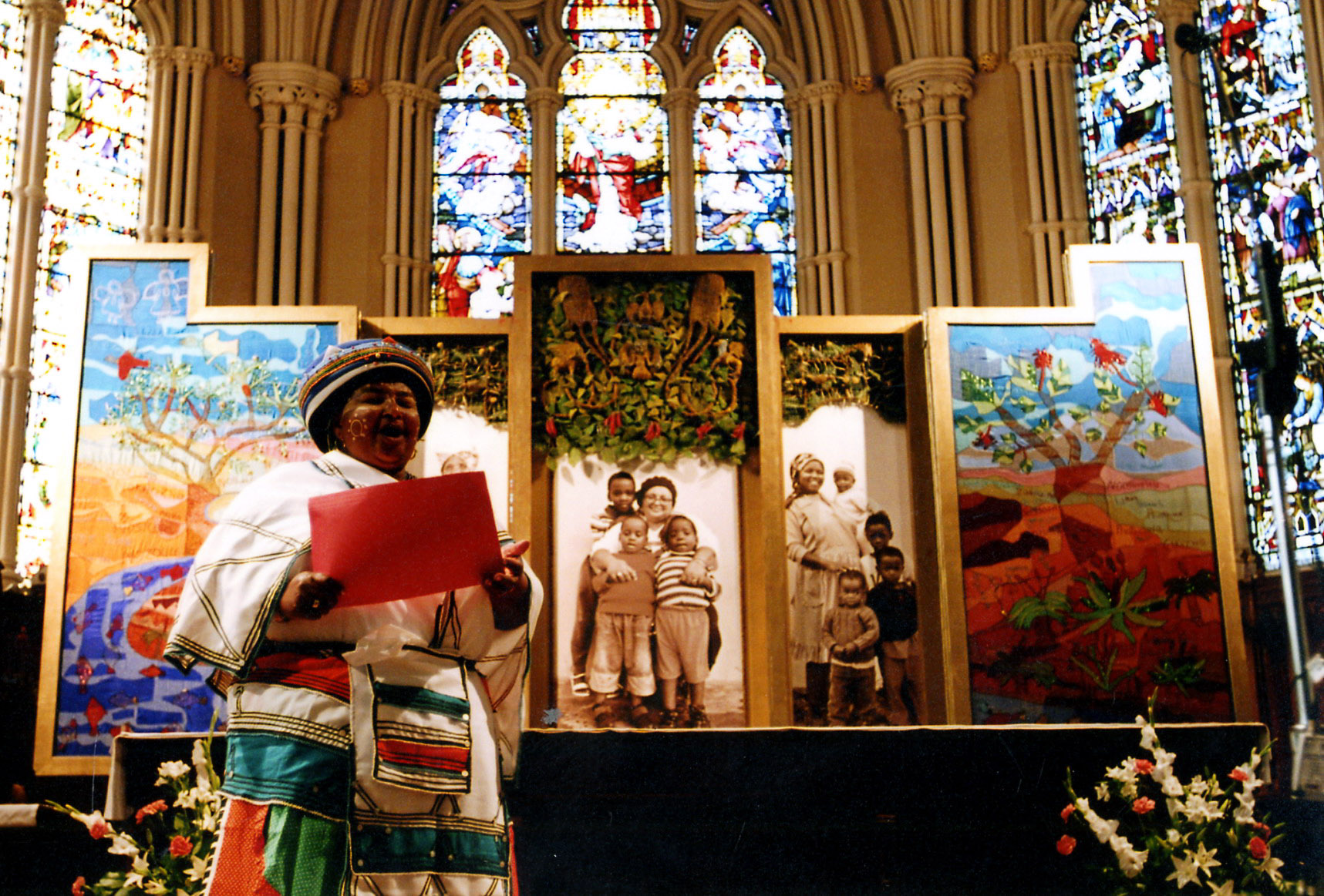 Eunice Mangwane presenting the altarpiece before her portrait at the Cathedral Church of St. James