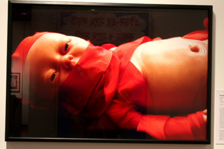 Penelope Siopis’s photograph *Baby in Red* displayed in the exhibition