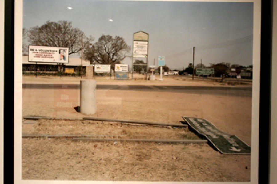 David Goldblatt’s photograph *Be a Volunteer, Join community home base care services, Dept. of Health and Welfare, Vaalwater Clinic/Kliniek, Vaalwater, Limpopo Province, in the time of AIDS* displayed in the exhibition