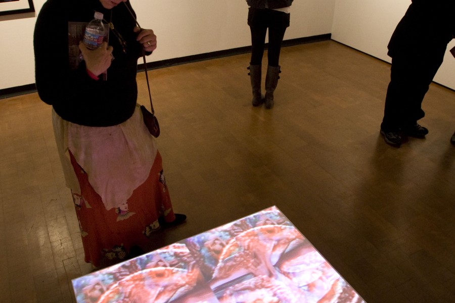 Visitors viewing a selection of artworks