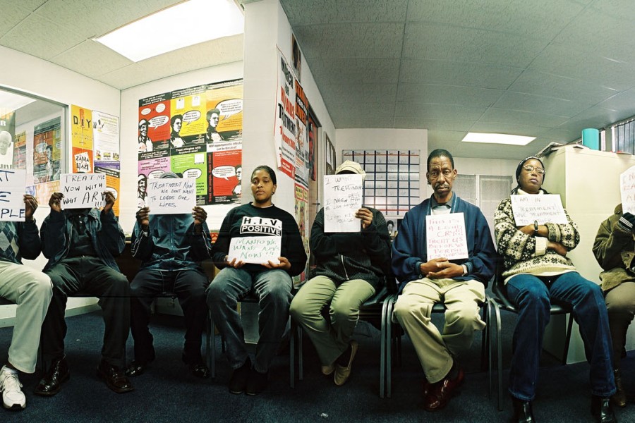 Gideon Mendel’s panoramic group portrait of 24 people at the Treatment Action Campaign office in Johannesburg