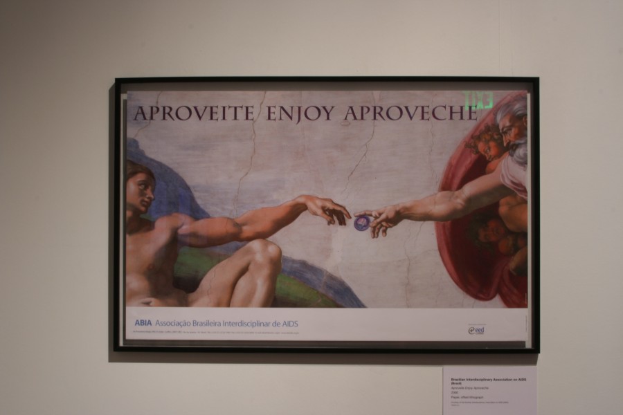 ABIA’s multilingual *Aproveite Enjoy Aproveche* poster reworking Michelangelo’s *The Creation of Adam*