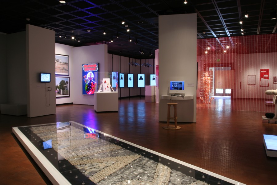 Wide gallery view of works displayed across multiple exhibition sections