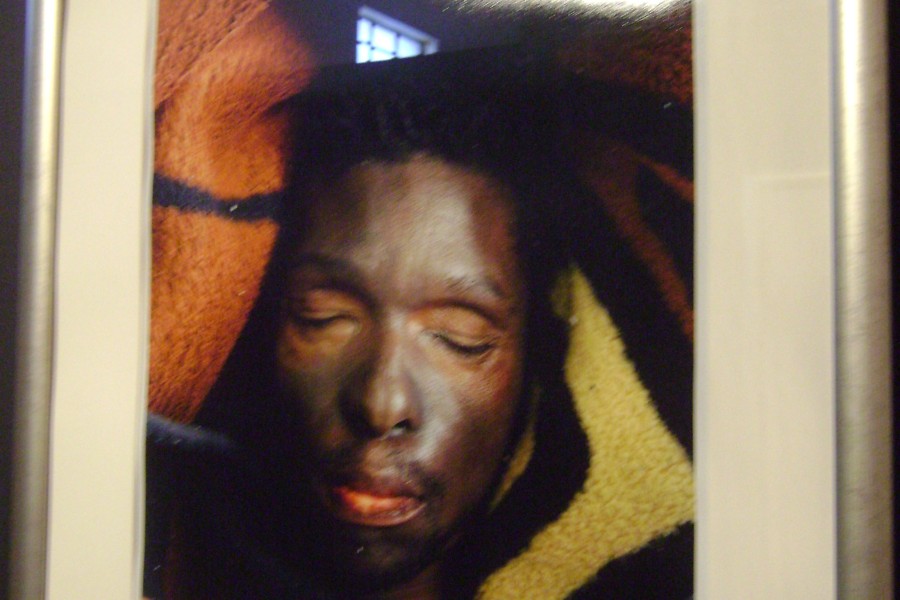 Pieter Hugo’s photograph of Monwabisi Mtana in his casket from *The Bereaved* series