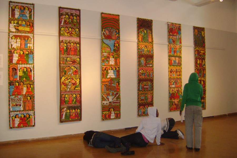 Visitors observing an installation in the gallery