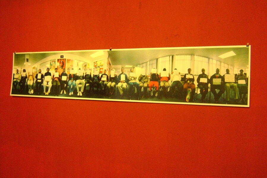 Gideon Mendel’s panoramic group portrait of 24 people at the Treatment Action Campaign office in Johannesburg