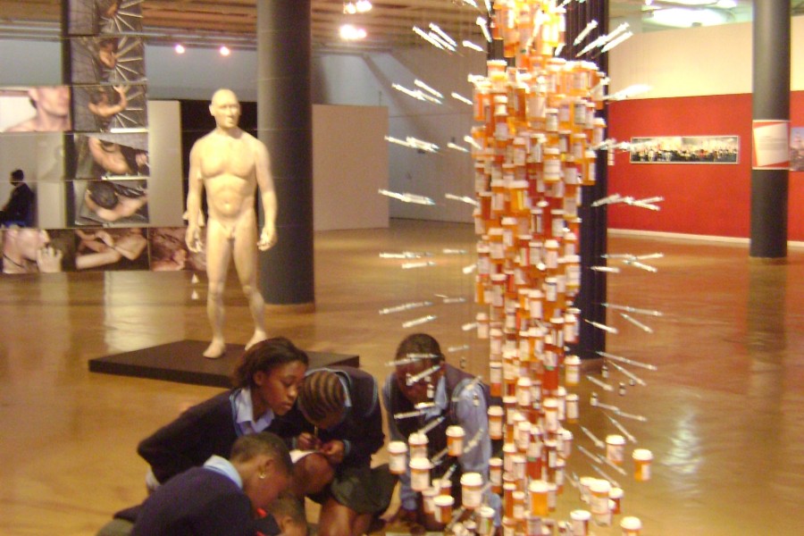 Visitors observing Daniel Goldstein and John Kapellas’s *Medicine Man*