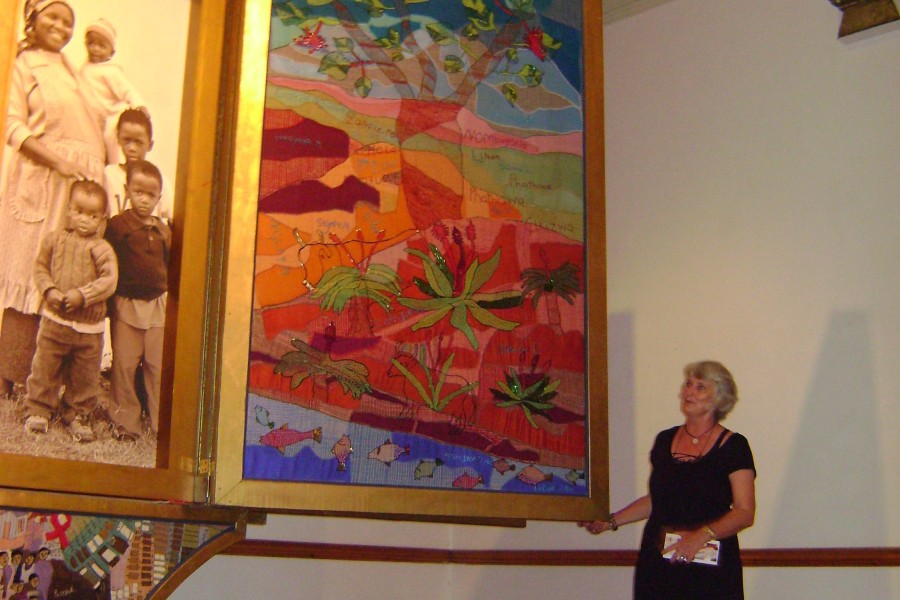 Visitor standing before the open Reality layer of the *Keiskamma Altarpiece*