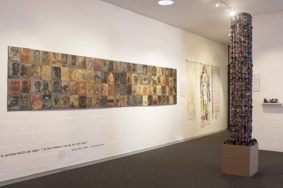 *Human Orphan Tower* beside *Reclaiming Our Future: Tribute Wall* and *Beaded Curtains*
