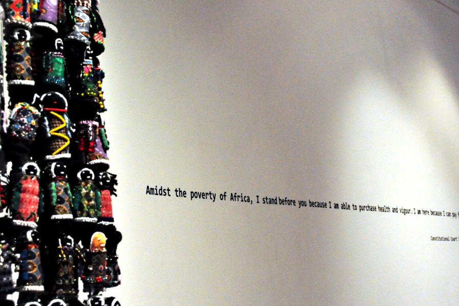 Human Orphan Tower beside a quotation by Edwin Cameron