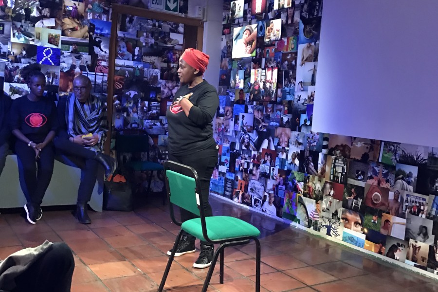 A Through Positive Eyes artivist sharing a personal story during live storytelling