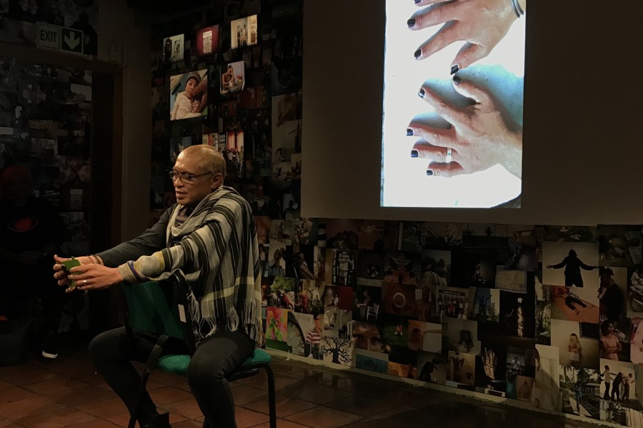 A Through Positive Eyes artivist sharing a personal story during live storytelling