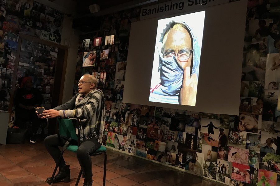 A Through Positive Eyes artivist sharing a personal story during live storytelling