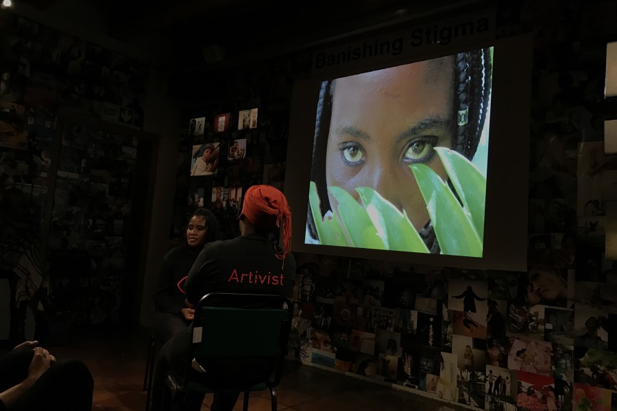 A Through Positive Eyes artivist sharing a personal story during live storytelling