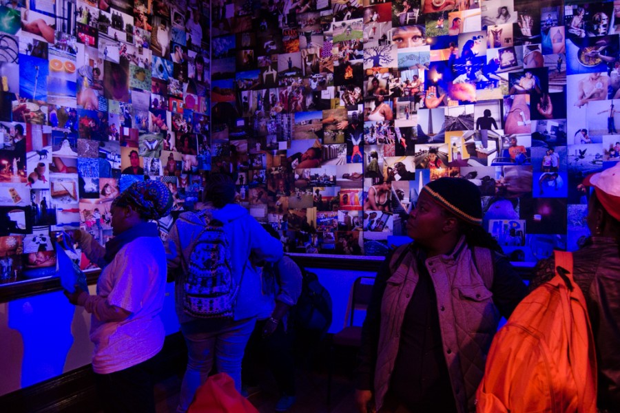 Visitors in the Banishing Stigma Room of Through Positive Eyes Durban Exhibit