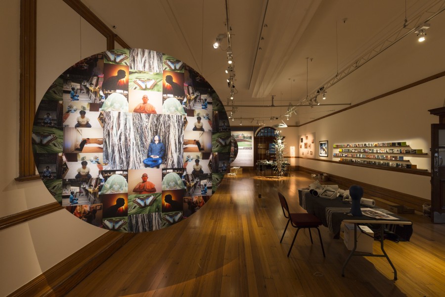 Daniel Goldstein’s meditation-themed photographic mandala displayed alongside other gallery works
