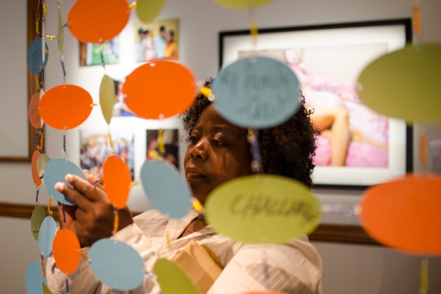 Visitor interacting with an artwork during the exhibition opening