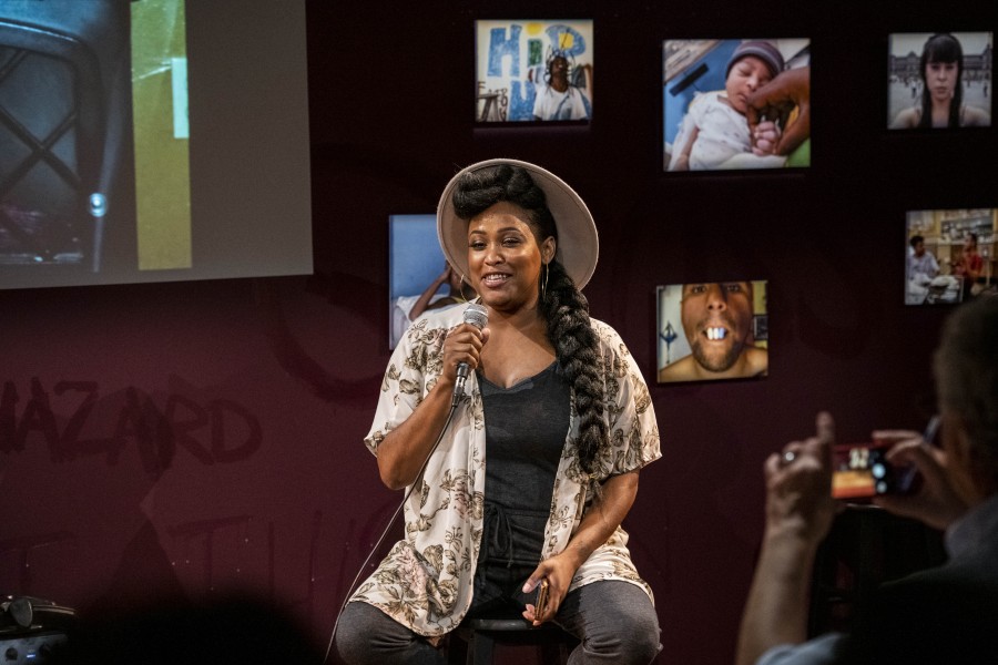 Porchia storytelling before an audience in the Banishing Stigma Room