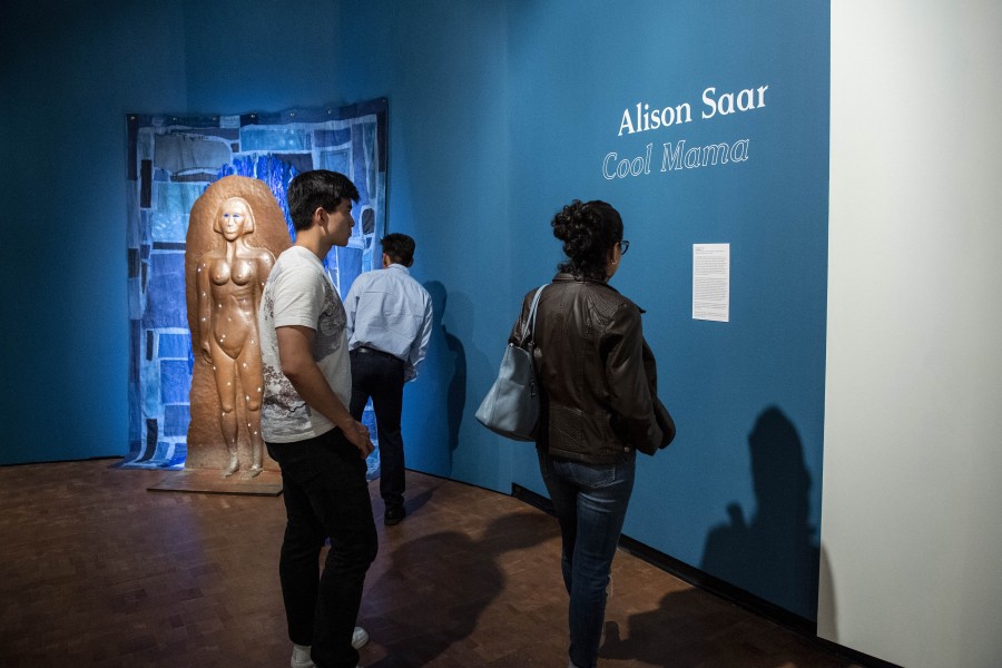 Visitors viewing Alison Saar’s sculpture Cool Mama
