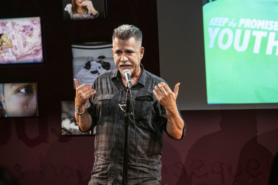 Joey storytelling before an audience in the Banishing Stigma Room