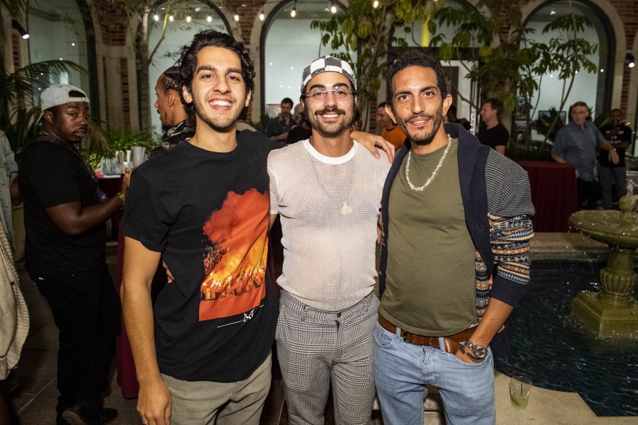 Vas standing with visitors at the exhibition opening