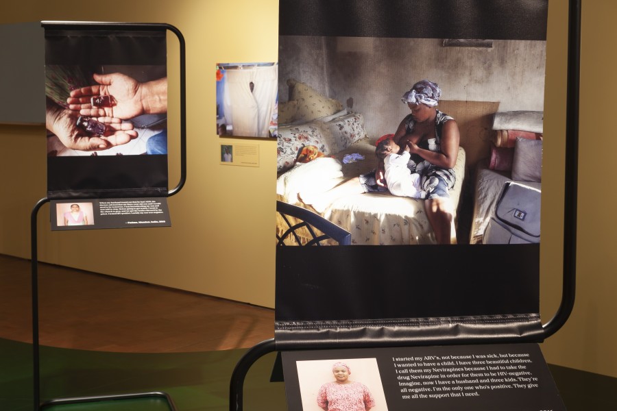 Photographs and stories by Through Positive Eyes artivists displayed with portraits by Gideon Mendel