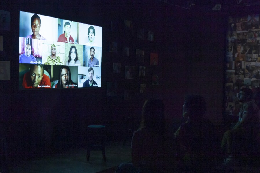Through Positive Eyes video portraits projected before an audience in the Banishing Stigma Room