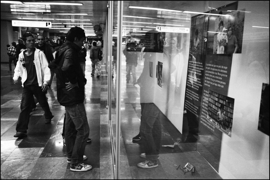 Viewers at the Through Positive Eyes Mexico City Metro Exhibition